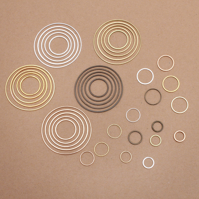 50 sztuk mosiężnych okrągłych wisiorków do tworzenia biżuterii - bransoletki, kolczyki DIY - Wianko - 2