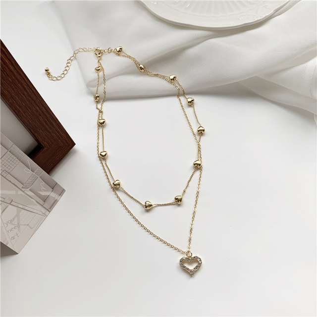 Koreański naszyjnik z wisiorkiem w kształcie serca - Biżuteria damskiego wieczoru ze złota i kryształów z romantycznym, wyciętym wzorem - Wianko - 8