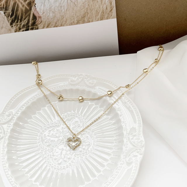 Koreański naszyjnik z wisiorkiem w kształcie serca - Biżuteria damskiego wieczoru ze złota i kryształów z romantycznym, wyciętym wzorem - Wianko - 7
