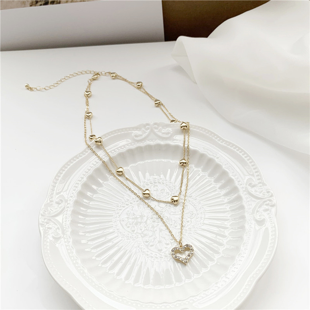 Koreański naszyjnik z wisiorkiem w kształcie serca - Biżuteria damskiego wieczoru ze złota i kryształów z romantycznym, wyciętym wzorem - Wianko - 6