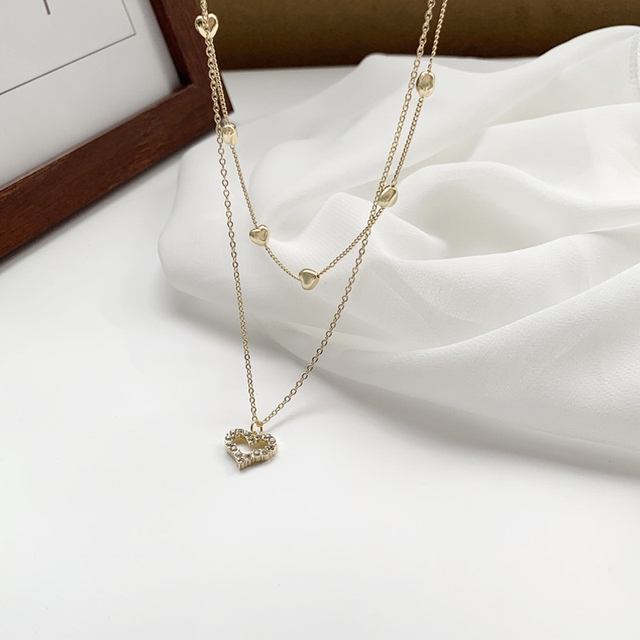 Koreański naszyjnik z wisiorkiem w kształcie serca - Biżuteria damskiego wieczoru ze złota i kryształów z romantycznym, wyciętym wzorem - Wianko - 5