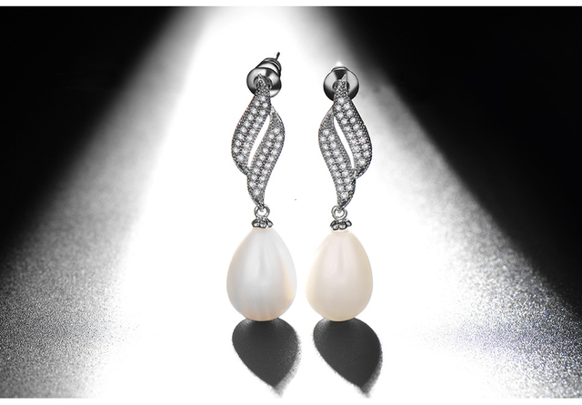Luoteemi - Eleganckie kolczyki wiszące z białą kroplą wodną, perłami i cyrkoniami - Srebrny kolor - Biżuteria ślubna - Wianko - 9