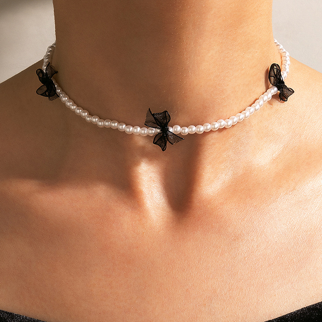 Nowoczesny naszyjnik z perłą i kamieniem Choker Tocona będący elegancką biżuterią dla kobiet i dziewcząt. Modny, dostosowywany kołnierz w kolorze czarnym z koronkowym wzorem - 20343 - Wianko - 1