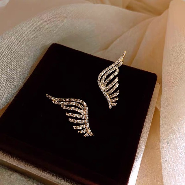 Srebrne kolczyki z zapięciem sztyft, wyłożone kryształkami w kształcie skrzydeł, biżuteria dla osób poszukujących nowoczesnych dodatków - Wianko - 31