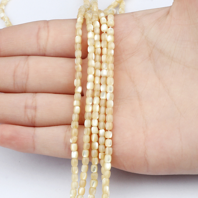 Naszyjnik Handmade z białymi naturalnymi matkami perłowymi w kształcie okręgu i krzyżem - Wianko - 2