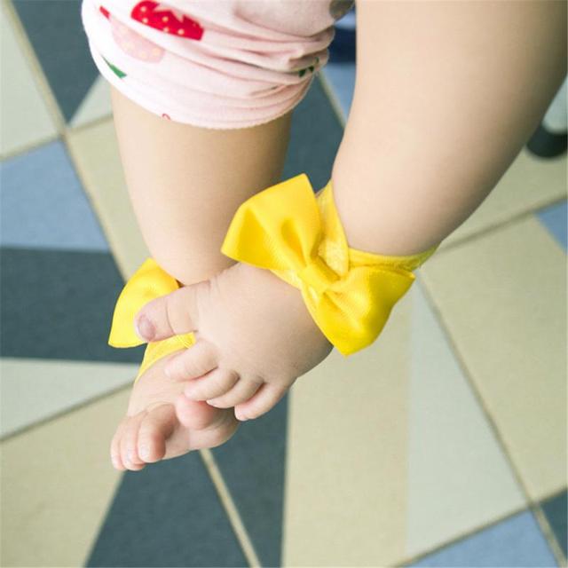 Stopy dla dzieci - akcesoria do fotografi noworodkowej z ozdobionymi łukami w jednolitym kolorze - Wianko - 9