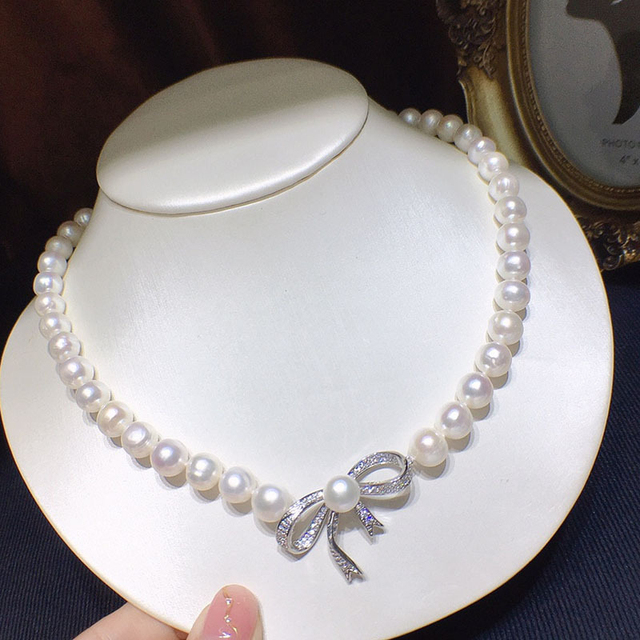 Naszyjnik choker HABITOO z białymi perełami słodkowodnymi 10-11MM i srebrnym wisiorkiem w kształcie kokardy - Wianko - 1