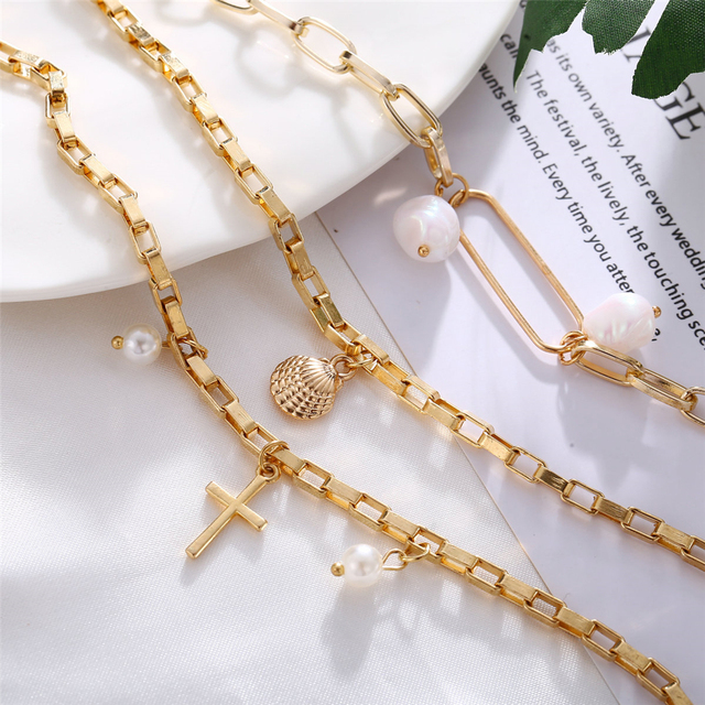 Modne bransoletki Boho z wieloma warstwami i złotą obudową, zdobione perłami, oraz krzyżem - idealne dodatki na rok 2020 - Wianko - 13